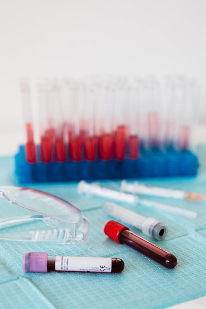 Full vials of blood among various equipment for safety taking blood from vein